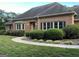 A beautiful brick home with neat landscaping and a curved walkway leading to the inviting front entrance at 2451 Old Salem Se Cir, Conyers, GA 30013