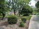 A traditional brick home with a lush front yard, mature trees, and a long driveway at 2451 Old Salem Se Cir, Conyers, GA 30013