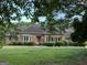 Charming brick home with a well-manicured lawn and mature landscaping, creating inviting curb appeal at 2451 Old Salem Se Cir, Conyers, GA 30013
