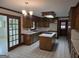 Classic kitchen with a center island, stainless appliances, and warm wood cabinets at 2451 Old Salem Se Cir, Conyers, GA 30013