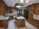 Bright kitchen with stainless steel appliances, a central island, and abundant cabinetry at 2451 Old Salem Se Cir, Conyers, GA 30013