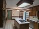 Well-lit kitchen with a central island, stainless steel appliances, and wood cabinetry at 2451 Old Salem Se Cir, Conyers, GA 30013