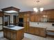 Large kitchen featuring stainless steel appliances, an island cooktop, and ample storage at 2451 Old Salem Se Cir, Conyers, GA 30013