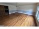 Bright living room with hardwood floors, wainscotting, and a classic chandelier at 2451 Old Salem Se Cir, Conyers, GA 30013