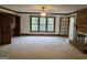 Living room features brick fireplace, large windows, and an open layout at 2451 Old Salem Se Cir, Conyers, GA 30013