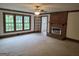 Inviting living room with brick fireplace and large bright windows at 2451 Old Salem Se Cir, Conyers, GA 30013