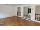 Open-concept living space featuring hardwood floors and natural light at 2451 Old Salem Se Cir, Conyers, GA 30013