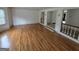 Spacious living room featuring pristine hardwood floors and bright natural light at 2451 Old Salem Se Cir, Conyers, GA 30013