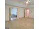 Spacious main bedroom with carpet floors and view of ensuite bathroom at 2451 Old Salem Se Cir, Conyers, GA 30013