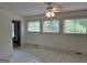Bright sunroom with tiled floors and large windows offering views of the surrounding landscape at 2451 Old Salem Se Cir, Conyers, GA 30013
