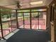 The spacious sunroom allows enjoyment of a large deck and views of the lush backyard at 2451 Old Salem Se Cir, Conyers, GA 30013