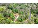 Aerial view showcasing property and wooded surroundings at 200 Whitney Way, Fayetteville, GA 30214