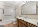 Functional bathroom features a bathtub with shower and a vanity with a built-in sink and ample storage space at 200 Whitney Way, Fayetteville, GA 30214