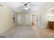 Expansive bedroom featuring plush carpeting, neutral walls, and multiple doors for easy access and flow at 200 Whitney Way, Fayetteville, GA 30214