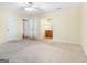 Spacious bedroom with neutral carpet, with easy access to an ensuite bathroom at 200 Whitney Way, Fayetteville, GA 30214