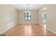 Dining room with neutral walls, wood floors, and a chandelier for formal dining at 200 Whitney Way, Fayetteville, GA 30214