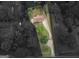 Overhead view of property surrounded by lush landscaping and a long, winding driveway at 2609 Lake Harbin Rd, Morrow, GA 30260