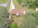 Aerial view of a home with a spacious yard surrounded by lush greenery at 2609 Lake Harbin Rd, Morrow, GA 30260