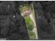 Aerial view of a home with a long driveway surrounded by mature trees at 2609 Lake Harbin Rd, Morrow, GA 30260