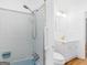 Bathroom featuring blue tile in the shower and a white vanity with a gold faucet at 2609 Lake Harbin Rd, Morrow, GA 30260