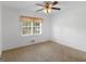 Bedroom with neutral carpeting and a window with curtains at 2609 Lake Harbin Rd, Morrow, GA 30260