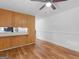 The dining room is adjacent to the kitchen and has wood flooring at 2609 Lake Harbin Rd, Morrow, GA 30260
