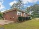 Well-maintained brick home with manicured shrubs and a sidewalk at 2609 Lake Harbin Rd, Morrow, GA 30260