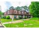 Charming townhomes with red roofing and well-maintained green lawn at 2986 Parc Lorraine, Lithonia, GA 30038