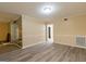 Living room with light wood-look flooring, trim, and fireplace at 2986 Parc Lorraine, Lithonia, GA 30038