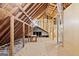 An unfinished attic features a wooden support structure and insulation at 3133 Callie Still Rd., Lawrenceville, GA 30045