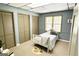 Cozy bedroom with built-in closets and warm neutral decor at 3133 Callie Still Rd., Lawrenceville, GA 30045