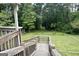 View from wooden stairs leading down to the grassy backyard area at 3133 Callie Still Rd., Lawrenceville, GA 30045