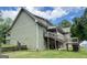 Exterior angle of home featuring back porch, deck and large lot at 3133 Callie Still Rd., Lawrenceville, GA 30045