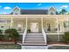 Inviting front porch with white railings and a staircase leading to a white front door under the dormered roof at 3133 Callie Still Rd., Lawrenceville, GA 30045