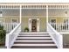 Close up of front porch with stairs and white railings at 3133 Callie Still Rd., Lawrenceville, GA 30045