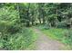 Beautiful grounds with a path and lush greenery at 3133 Callie Still Rd., Lawrenceville, GA 30045