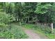 Grounds with a path, trees, gate and greenery at 3133 Callie Still Rd., Lawrenceville, GA 30045