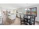 This expansive kitchen features stainless appliances, granite countertops, an island cooktop, and an eat-in dining area at 3133 Callie Still Rd., Lawrenceville, GA 30045