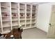 Office space featuring built-in bookshelves, a desk, and neutral carpeting at 3133 Callie Still Rd., Lawrenceville, GA 30045