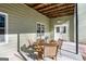 Outdoor patio with a glass table and chairs, perfect for al fresco dining and outdoor entertaining at 3133 Callie Still Rd., Lawrenceville, GA 30045