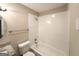 A well-maintained bathroom with white fixtures, updated granite vanity, and tub-shower combination at 5219 Maple Valley Sw Rd, Mableton, GA 30126