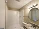 Clean white bathroom featuring a tiled shower, granite vanity, and bright lighting at 5219 Maple Valley Sw Rd, Mableton, GA 30126
