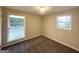 Bright bedroom with neutral paint, natural light, and updated carpet flooring at 5219 Maple Valley Sw Rd, Mableton, GA 30126