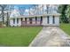 Charming one-story home with a brick facade, complemented by a well-manicured lawn and inviting front porch at 5219 Maple Valley Sw Rd, Mableton, GA 30126