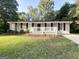 Charming one-story home with brick exterior, black shutters, and a welcoming front porch at 5219 Maple Valley Sw Rd, Mableton, GA 30126