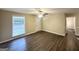 Living room with hardwood floors, natural light, ceiling fan, and view of front yard at 5219 Maple Valley Sw Rd, Mableton, GA 30126