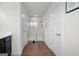 Bright bathroom hallway featuring a glass-enclosed shower and hardwood style floors at 838 Maduro Way, Mcdonough, GA 30253