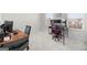 Bedroom with a gaming setup, featuring two desks, a gaming chair, and natural light at 838 Maduro Way, Mcdonough, GA 30253