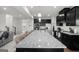 Gorgeous kitchen with granite counters, stainless appliances, and dark cabinetry at 838 Maduro Way, Mcdonough, GA 30253