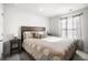 Spacious main bedroom featuring a large bed with plush bedding and matching bedside tables at 838 Maduro Way, Mcdonough, GA 30253